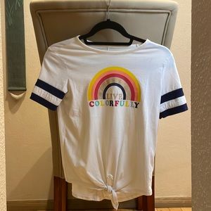 White tee with blue stripes on sleeves